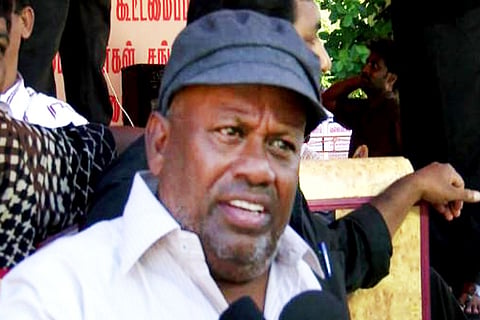 Veteran actor Senthil is seen wearing a white shirt and blue cap in the image.