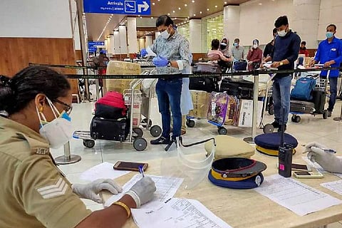People standing in line at an airport 