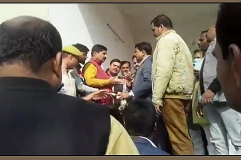 A screenshot from the video which shows MoS Ajay Mishra in a scuffle with the media