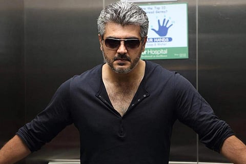 Actor Ajith is seen wearing a black sweatshirt, sporting the salt n pepper hairstyle in the image.