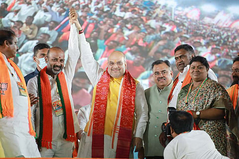 Amit Shah with Telangana BJP chief Bandi Sanjay at a public meeting in Tukkuguda, he said BJP will end minority reservation in Telangana