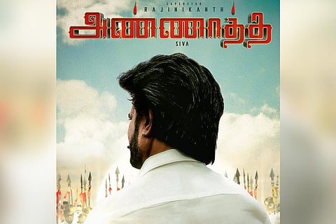 Rajinikanth is seen in a white shirt, with his back facing the camera in an image from the new poster