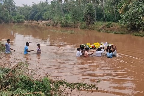 Villagers taking a dead body for burial