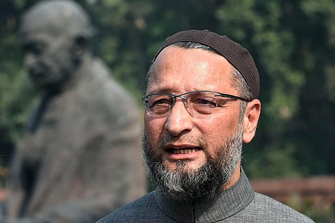 Asaduddin Owaisi and Mahatma Gandhi in the background