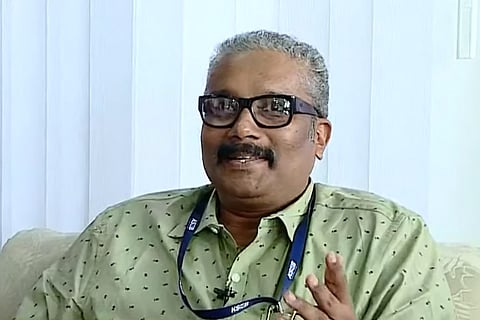 Screenshot of B Ashok speaking to a reporter