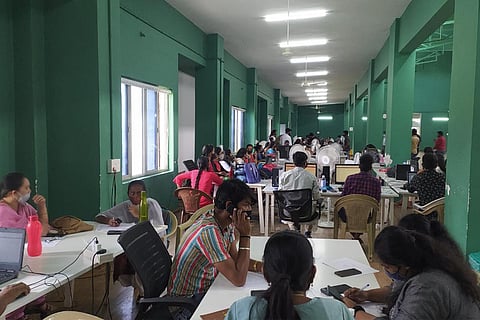 A lot of people speak on phones in the BBMP South zone war room in which BJP MP Tejasvi Surya created a ruckus recently