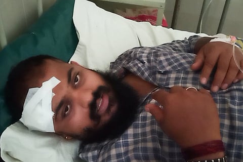 Assault victim Anil Poojary in hospital