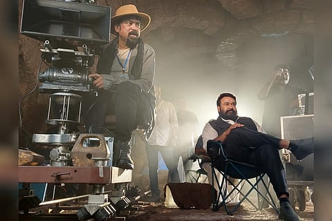 Mohanlal is seen watching the shoot, while cinematographer Santosh Sivan is seen cranking the camera.