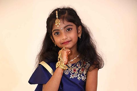 Rachel Prisha wearing a blue dress
