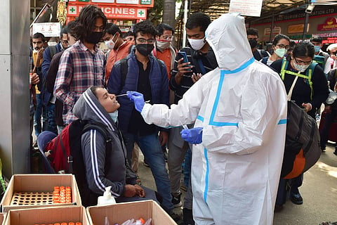 A health worker collecting a woman's swab sample for a COVID test: India sees nearly 1.6 lakh new COVID-19 cases in 24 hours, highest in 224 days 