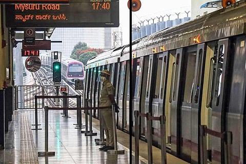A metro train stopped at a platform in Bengaluru