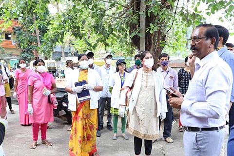 The Bengaluru Commissioner addresses a group of women wearing masks regarding coronavirus pandemic.