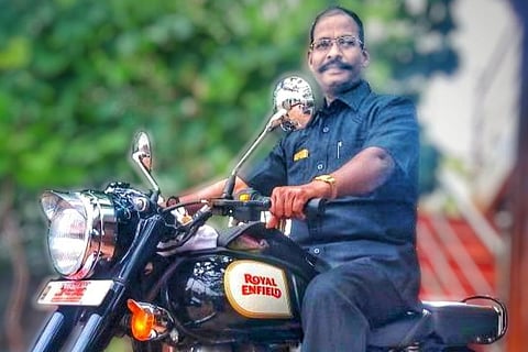 Trichy Special Sub Inspector S Boominathan riding a bike