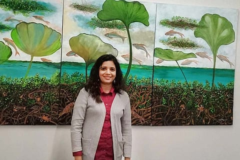 Bindhi in front of her painting at the Lokame Tharavadu show