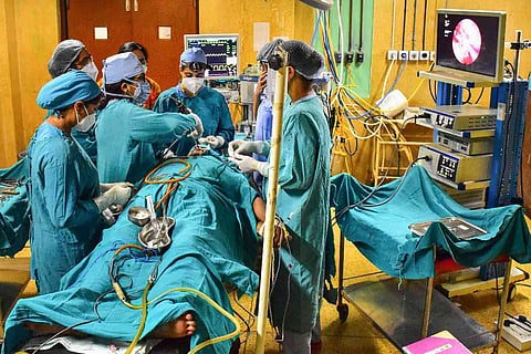 Doctors treating a black fungus patient 