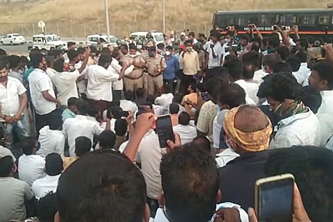 Taxi drivers in Bengaluru protesting at the airport over the death of their colleague