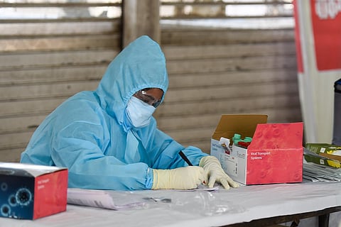 Doctor prepares to conduct swab tests for COVID-19