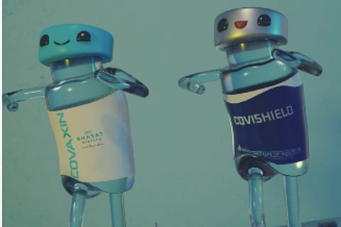 Covaxin and Covishield vials dancing 