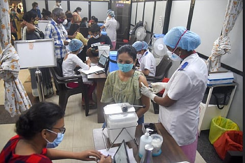 Health worker takes swab samples for COVID-19 testing as coronavirus cases surge in Kozhikode. 