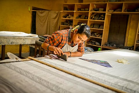 A woman involved in weaving work at Charaka Society, Heggodu, Karnataka
