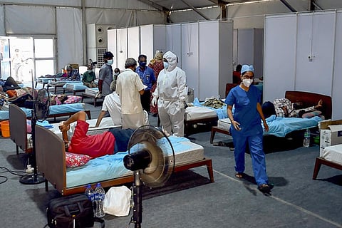COVID-19 patients undergo treatment at a COVID-19 treatment centre in Chennai