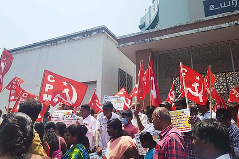 “People raising CPI(M) flags in protest against rising fuel prices”