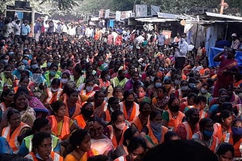 Women corporation workers sitting in protest 