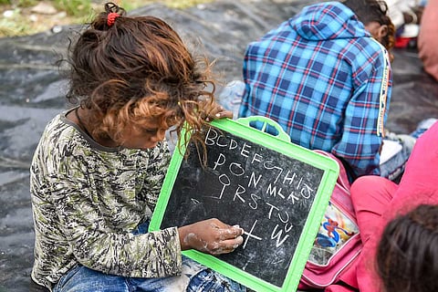 A child attends a class conducted by police personnel in Kolkata 