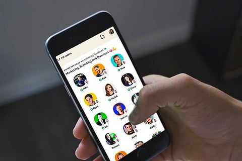 A person browsing Clubhouse on phone 