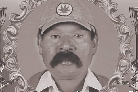 Black and white poster of man with moustache