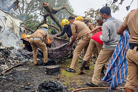 Fire Force, police and local residents trying to remove debris at the Coonoor helicopter crash site
