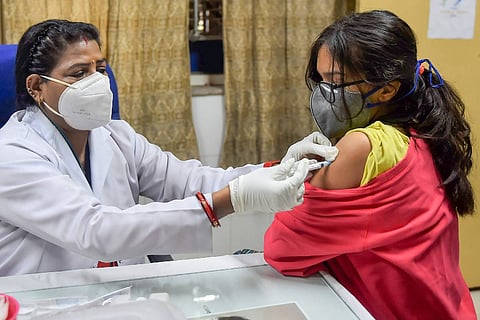 Representative image of a woman getting a vaccine shot