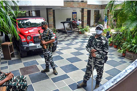 Security personnel stand guard at the residence of the owner of Dainik Bhaskar Group Sudhir Agarwal after Income Tax department raided his premises, in Bhopal, Thursday, July 22, 2021.