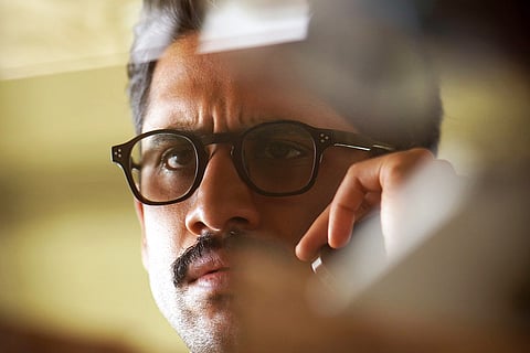 Naga Chaitanya in Dhoota poster 