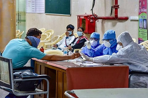 Medical professionals assessing a patient 
