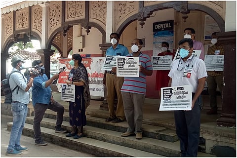Kerala Doctors Protest holding placard standing outside the General Hospital in Thiruvananthapuram 
