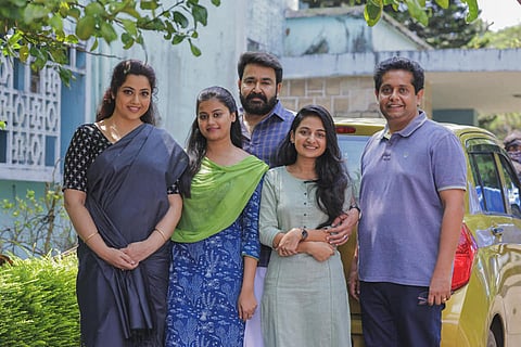 Mohanlal, Meena and two kids of Drishyam with director Jeethu Joseph 