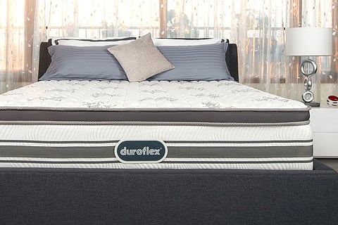 An image of a Duroflex mattress on a bedframe