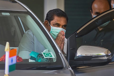 Tamil Nadu Chief Minister Edappadi Palaniswami folds his hands while coming out of a car