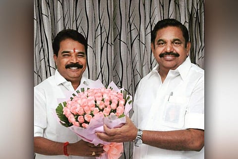 Image of R Elangovan with AIADMK leader EPS, both wearing white shirt. 
