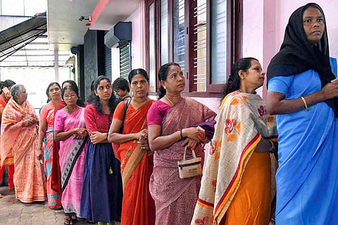 Voters standing in a queue
