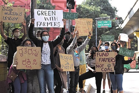 FFF members in Bengaluru holding placards for a pro farmer protests