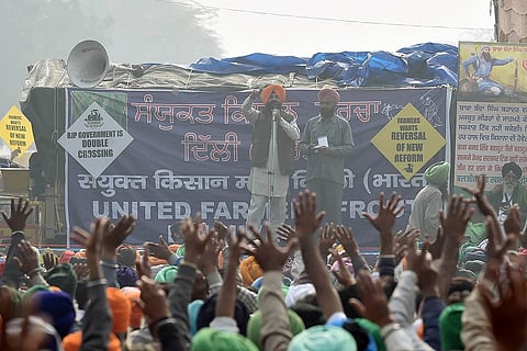 Farmers shout slogans against farm laws at Singhu border, New Delhi