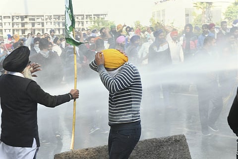 Farmers in Haryana on their way to Delhi to protest hit with water cannons