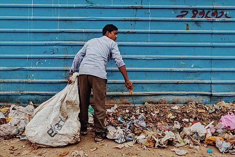Man picking up garbage