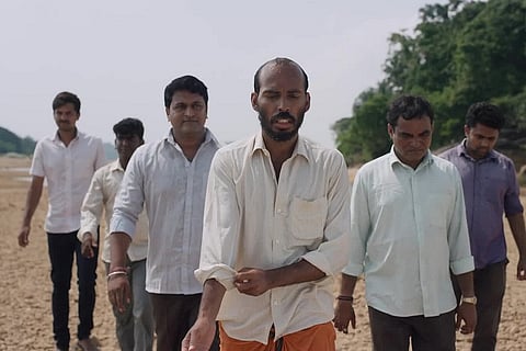 Raj Shetty and Rishab Shetty along with others in Garuda Gamana Vrishaba Vahana