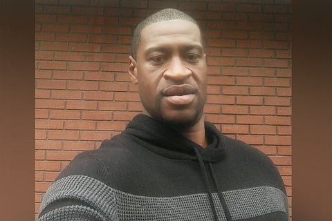 A selfie of George Floyd against a brick wall