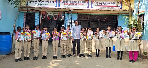 Headmaster Mohammad Akbar along with his students