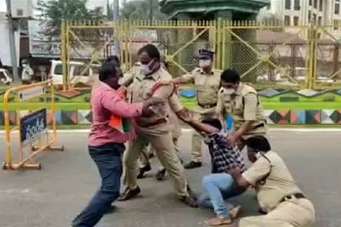 Hindu Vahini workers being whisked away by cops during protest
