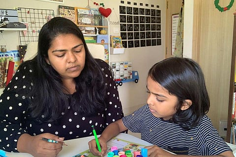 Gracelyne Fernando teaching her son